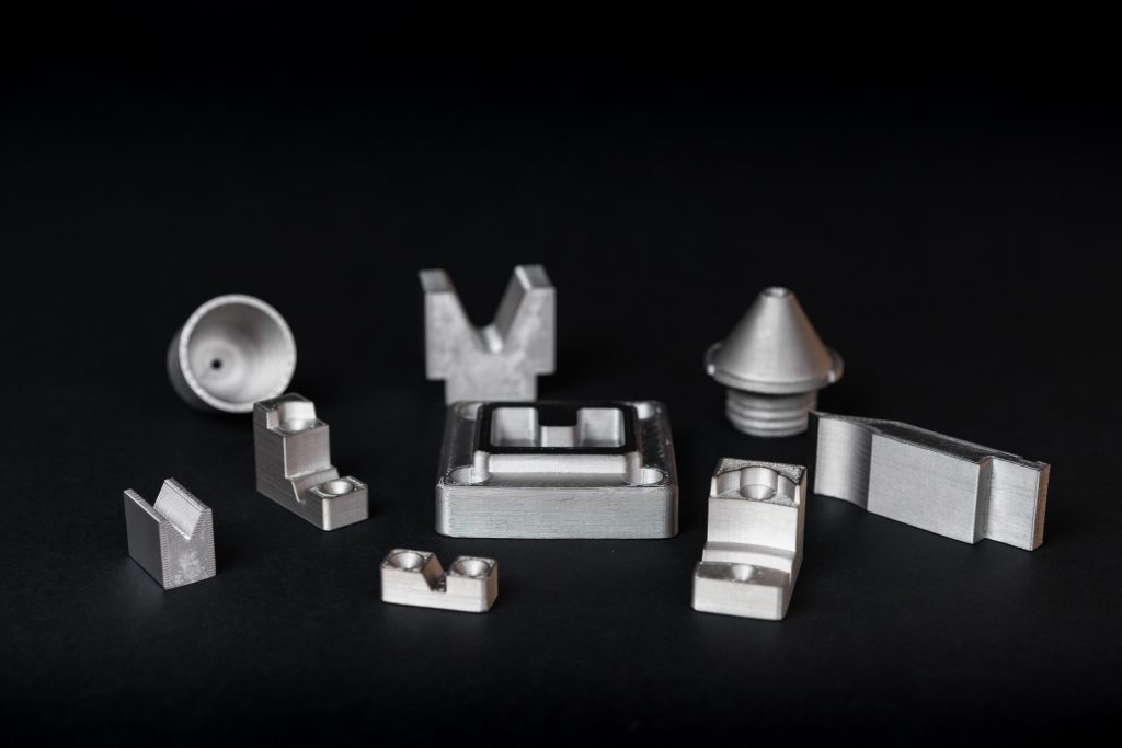 Range of 3D printed H13 tool steel parts. Photo via Markforged